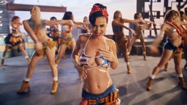 Katy Perry in a bikini, touching her body in music video for Woman's World 