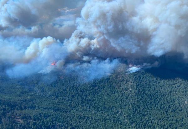 Wildfires threaten western Canada city as far north evacuated