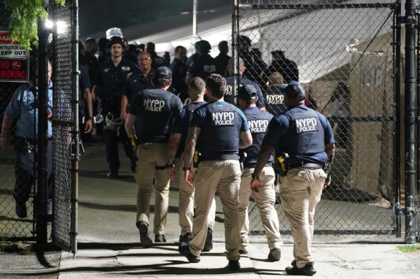 NYPD cops at the Randall's Island shelter. 