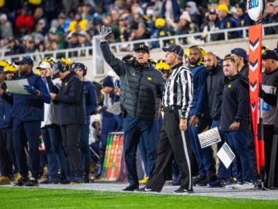 Members of the Illinois football team send in signals during an NCAA college football game against Wisconsin Saturday, Oct. 21, 2023, in Champaign, Ill. (AP Photo/Charles Rex Arbogast)