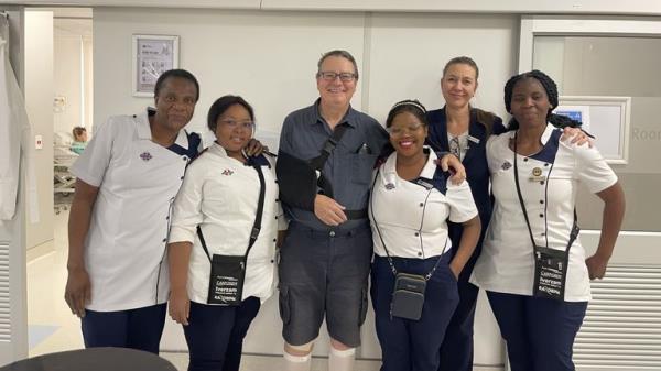 Roland Sherry and the staff who treated him in Zambia, photos from Lucy Plint